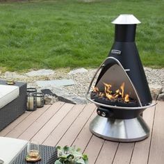 a fire pit sitting on top of a wooden deck