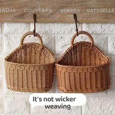 two wicker baskets hanging on a brick wall with the caption it's not wicker weaving