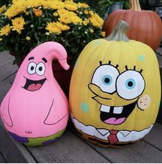 two pumpkins painted to look like cartoon characters