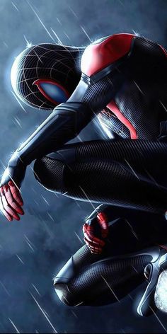 a spider - man standing in the rain with his hands on his hips