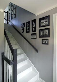 stairs with pictures on the wall above them