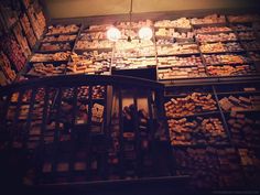 a room filled with lots of different types of chocolates on display in glass cases