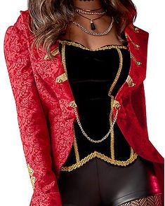 a woman wearing a red jacket and black top with gold trimmings on it