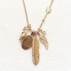 18 carat rose gold vermeil charm necklace, featuring two sea shells, an engraved quote, a diamond feather, an angel wing and a white pearl charm. Feather Arrow, Diamond Charm Necklace, Diamond Charm, Pearl Charms, Gemstone Pendant, Layered Necklaces, Diamond White, Gold Vermeil, Chains Necklace