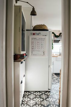 a white refrigerator freezer sitting inside of a kitchen