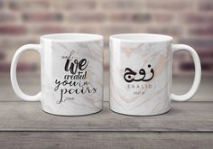 two coffee mugs sitting on top of a wooden table with the words, we are afraid