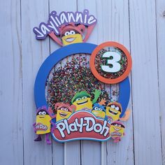 a birthday cake topper with the number three on it