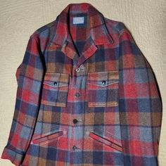 Size Medium Like New Condition Very Warm Plaid Heavy Weight 100% Virgin Wool Jacket Naturally Stain And Odor Resistant Unlined Made In The Usa 2 Button Through Chest Pockets 2 Angled Welt Pockets Classic Plaid Outerwear With Spread Collar, Blue Unstructured Outerwear For Fall, Blue Spread Collar Outerwear For Fall, Blue Outerwear With Spread Collar For Fall, Plaid Outerwear With Button Closure And Spread Collar, Plaid Outerwear With Pockets And Spread Collar, Red Winter Outerwear With Welt Pockets, Red Fall Outerwear With Patch Pockets, Classic Single Breasted Outerwear With Camp Collar