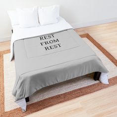 a white bed with red lettering on it