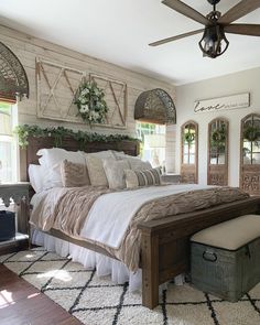 a large bed sitting inside of a bedroom on top of a white carpeted floor