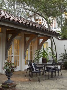 an outdoor patio with tables and chairs