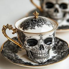 a tea cup with a skull decoration on it