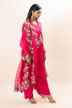 Fuchsia kurta with floral bloom embroidery. Paired with a pant and dupatta.
Components: 3
Pattern: Hand Embroidery
Type Of Work: Floral, Thread
Neckline: Round Neck
Sleeve Type: Three Quarter Sleeves
Fabric: Kurta: Modal Satin, Pant: Modal satin, Dupatta: Silk organza
Color: Pink
Other Details: 
Floral embroidered border on dupatta
Closure: Elastic
Occasion: Puja - Aza Fashions Traditional Floral Embroidered Palazzo Set For Wedding, Traditional Floral Embroidery Palazzo Set For Wedding, Wedding Semi-stitched Palazzo Set With Floral Embroidery, Pink Raw Silk Set With Floral Embroidery, Festive Wedding Palazzo Set With Floral Embroidery, Semi-stitched Slub Silk Salwar Kameez With Floral Embroidery, Wedding Palazzo Set With Floral Embroidery In Raw Silk, Navratri Wedding Palazzo Set With Floral Embroidery, Floral Embroidery Sets With Traditional Drape In Georgette