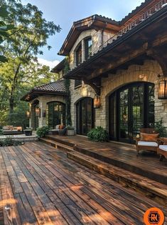 a large wooden deck in front of a house