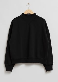 Relaxed mock neck sweatshirt featuring triangular ribbed detailing at the collar.– Ribbed cuffs and hemline
– Raglan sleevesLength of sweatshirt: 53.5cm / 21.1" (Size S) Black Mock Turtleneck, Mock Neck Sweatshirt, Black Mock Neck, Turtleneck Sweatshirt, Neck Hoodie, Mock Turtleneck, Fashion Story, Vintage Jeans, Feminine Style