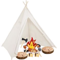 a teepee tent with logs and fire on the ground next to it, including marshmallows