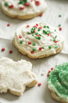 decorated cookies are sitting on a baking sheet