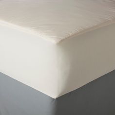 an unmade bed with no sheets on it