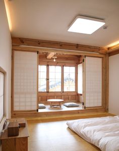 an empty room with tatami mats on the floor and large windows in the wall