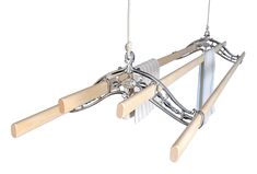 a wooden and metal object hanging from strings