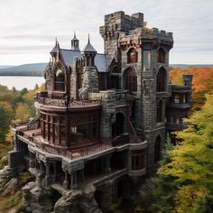 an aerial view of a castle like building with many windows and balconies on the roof