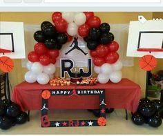 an image of a birthday party with balloons and basketballs on the table in front of it