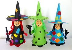 three paper dolls are dressed up as witches