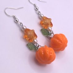 ♡ Cute earrings featuring beads in the shape of small pumpkins ! ↝ All earrings are made by me, by hand!! Due to Handmade nature, there may be some imperfections. Please treat with care ! Please message me with any questions, concerns, or cancellations (before shipped out). Cute Handmade Orange Jewelry, Cute Orange Dangle Jewelry, Cute Orange Handmade Jewelry, Cute Orange Drop Earrings, Star Pumpkin, Earrings To Make, Autumn Earrings, Clay Things, Lampwork Jewelry