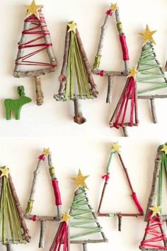 christmas tree ornaments made out of sticks and colored yarn are hanging on the wall in three different ways