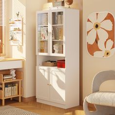 a white bookcase in the corner of a room next to a desk and chair