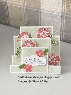 a close up of a greeting card with flowers on the front and bottom, along with a plaid background