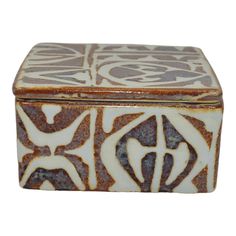 a brown and white box with designs on it