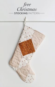 a christmas stocking hanging on a wall with the text free christmas stocking pattern