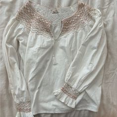 New With Tags Faherty Laura Embroidered Top In White Whisper. Size Medium. Has One Small Black Smudge (Pictured) Otherwise In Great Condition. White Cotton Peasant Embroidered Top, White Long Sleeve Peasant Top With Embroidered Hem, White Cotton Embroidered Top With Lace Trim, White Peasant Top With Embroidered Hem, Casual White Peasant Top With Embroidered Hem, White Long Sleeve Cotton Peasant Top, White Cotton Long Sleeve Peasant Top, Beige Embroidered Cotton Peasant Top, Embroidered Top