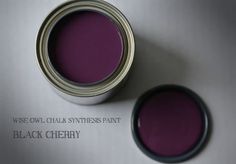 a can of black cherry paint sitting on top of a white surface with the words wise owl, chalk synthesizer paint