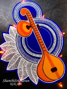 an orange ukulele sitting on top of a blue and white sign with lights in the background