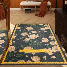 a large blue rug with flowers on it in a living room next to a mirror