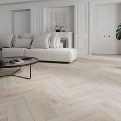 a living room with white walls and wood flooring on the floors is pictured in this image