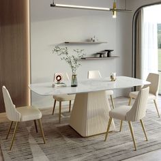 a dining room table with white chairs around it