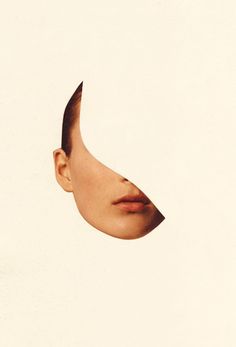 a woman's face is shown through a hole in the paper