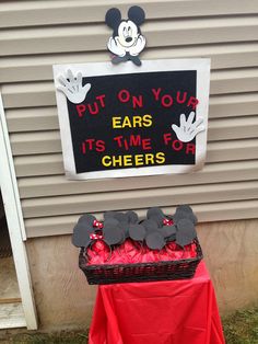 a mickey mouse birthday party with red and black candy in the shape of ears, it's time for cheers