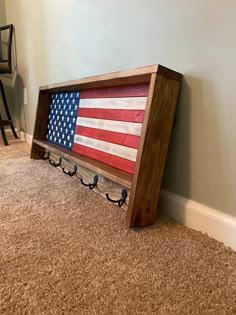 an american flag is hanging on the wall