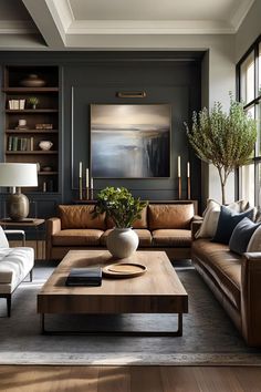 a living room filled with furniture and a painting on the wall above it's windows