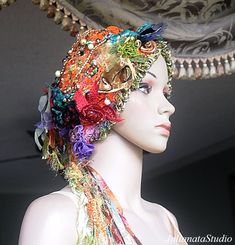 I've created this funky La Belle Epoque retro style VERSATILE TRANSFORMER HEADPIECE - HAT INTO TURBAN.  Cozy, warm, and very feminine PIECE OF WEARABLE FIBER ART with elegance and style.  It is incredibly soft to the touch - the touch of QUALITY.  The headpiece is adorned with TWO HANDCRAFTED LARIATS WITH TASSELS.  It will stretch and is sized for a teen or adult head - 21 to 23 inches.    Care instructions: hand wash the item in lukewarm water.  Squeeze gently. To dry, lay the garment on a flat Adjustable Bohemian Headwrap For Festivals, Bohemian Festival Hat With Headband, Bohemian Handmade Festival Headwrap, Bohemian Carnival Headband, Whimsical Adjustable Multicolor Headband, Bohemian Headband For Costume, Whimsical Multicolor Adjustable Headpieces, Bohemian Headband For Costume Occasions, Unique Festival Headband Headpiece