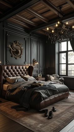 a large bed sitting in the middle of a bedroom next to a chandelier