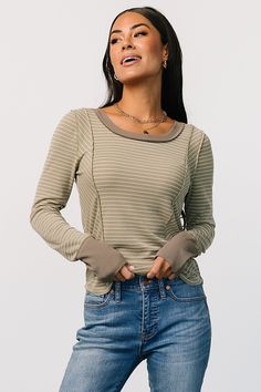 Elevate your wardrobe with our Ashford Striped Top in Olive. With comfortable, stretchy material and cute white strips, this versatile piece is perfect for any occasion. Olive Stretch Tops For Fall, Fitted Long Sleeve Tops With Striped Cuffs, Olive Long Sleeve Top For Layering, Trendy Stretch Olive Tops, Casual Tops With Striped Cuffs, Baltic Born, Olive Color, Cup Size, Stretchy Material