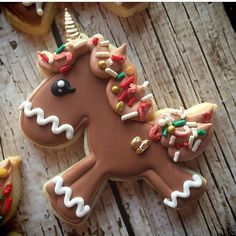 decorated cookies with icing on wooden table