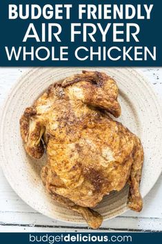 a whole chicken on a plate with the title budget friendly air fryer whole chicken