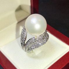 Enormous SOUTH SEA PEARL, absolutely natural color and luster, 14.5 mm in size, surrounded by 257 pieces of hand-set E/VVS superb quality diamonds, weighting at 3.05 carats. Set in handcrafted, one of a kind 18K solid white gold ring, weighting at 13.5 grams. The pearl is naturally cultured from South Australia Sea, its luster is extra fine, AA+ grade with 85% clean surface. SUGGESTED RETAIL PRICE: $13,800 The ring is hand crafted to a high standard and is NOT mass machine produced and is brand Golden South Sea Pearls, Sea Pearl, South Seas, South Sea Pearls, Sea Pearls, White Gold Engagement Rings, Pearl Diamond, White Gold Ring, South Australia