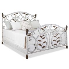 a bed with white linens and pillows on it's headboard, in front of a white background